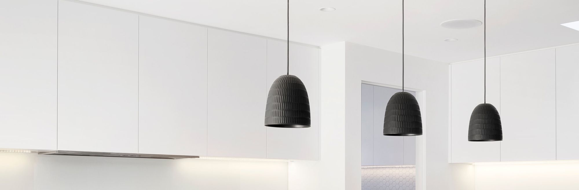black pendants hanging in a kitchen setting