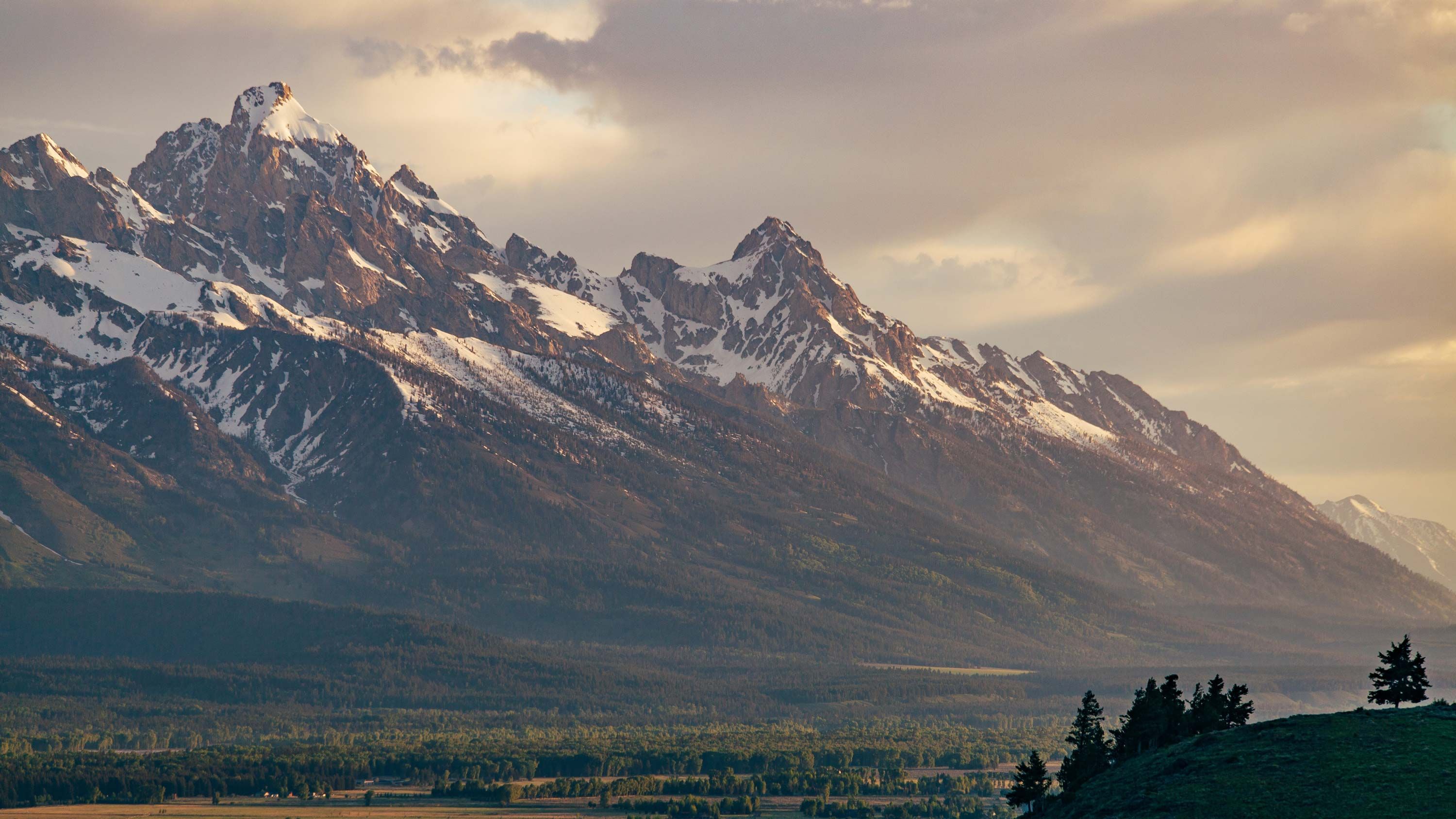 Landscape of snow-capped Wyoming mountains.